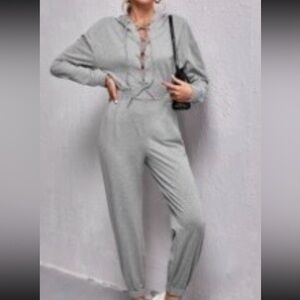 Jumpsuit lace up front drop shoulder hooded Size Medium NWT